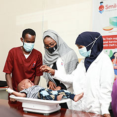 Three people with a baby. Read about Gifts by Will Three people with a baby. Read about Gifts by Will