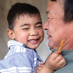 Photo of a father holding his son and smiling. Read about Donor-Advised Funds Photo of a father holding his son and smiling. Read about Donor-Advised Funds