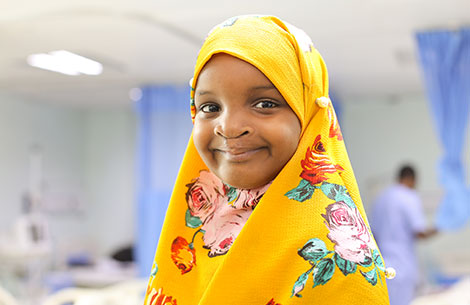 A young girl smiling